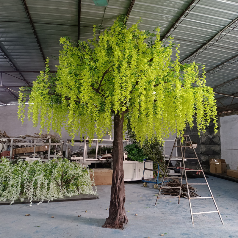 Artificial wisteria tree with flowering strands hanging from a broad plastic canopy