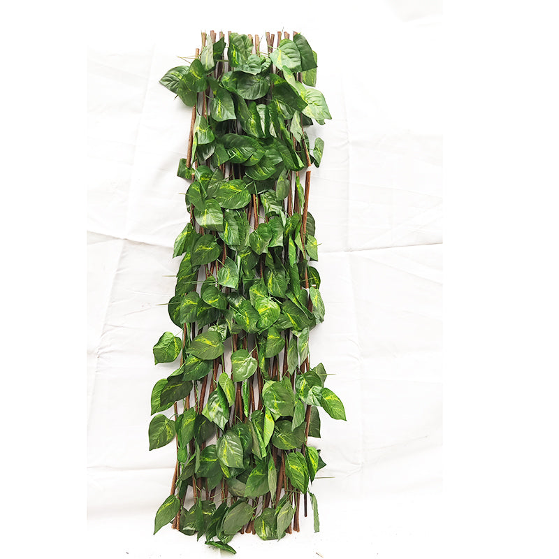 The ivy fence panel fitted to a balcony railing, screening an apartment terrace