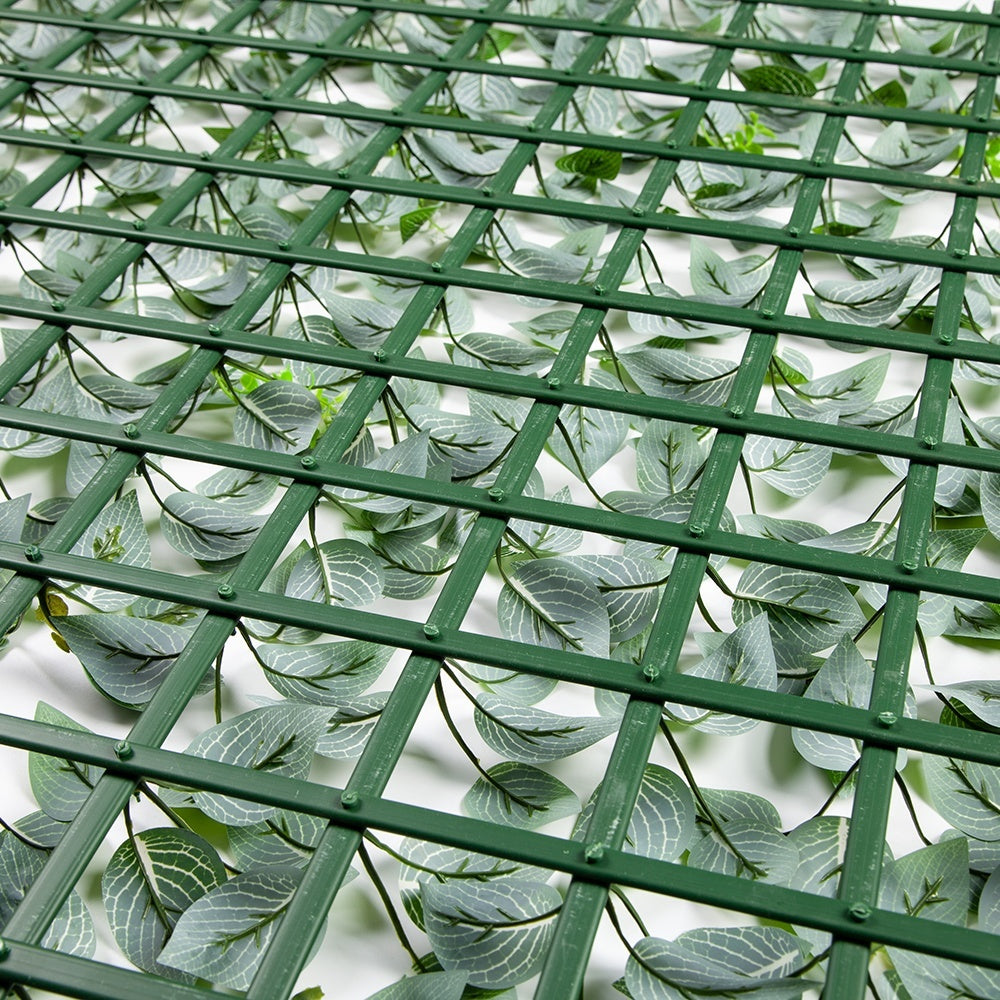 The green screen panel used along a hospitality patio to divide seating areas
