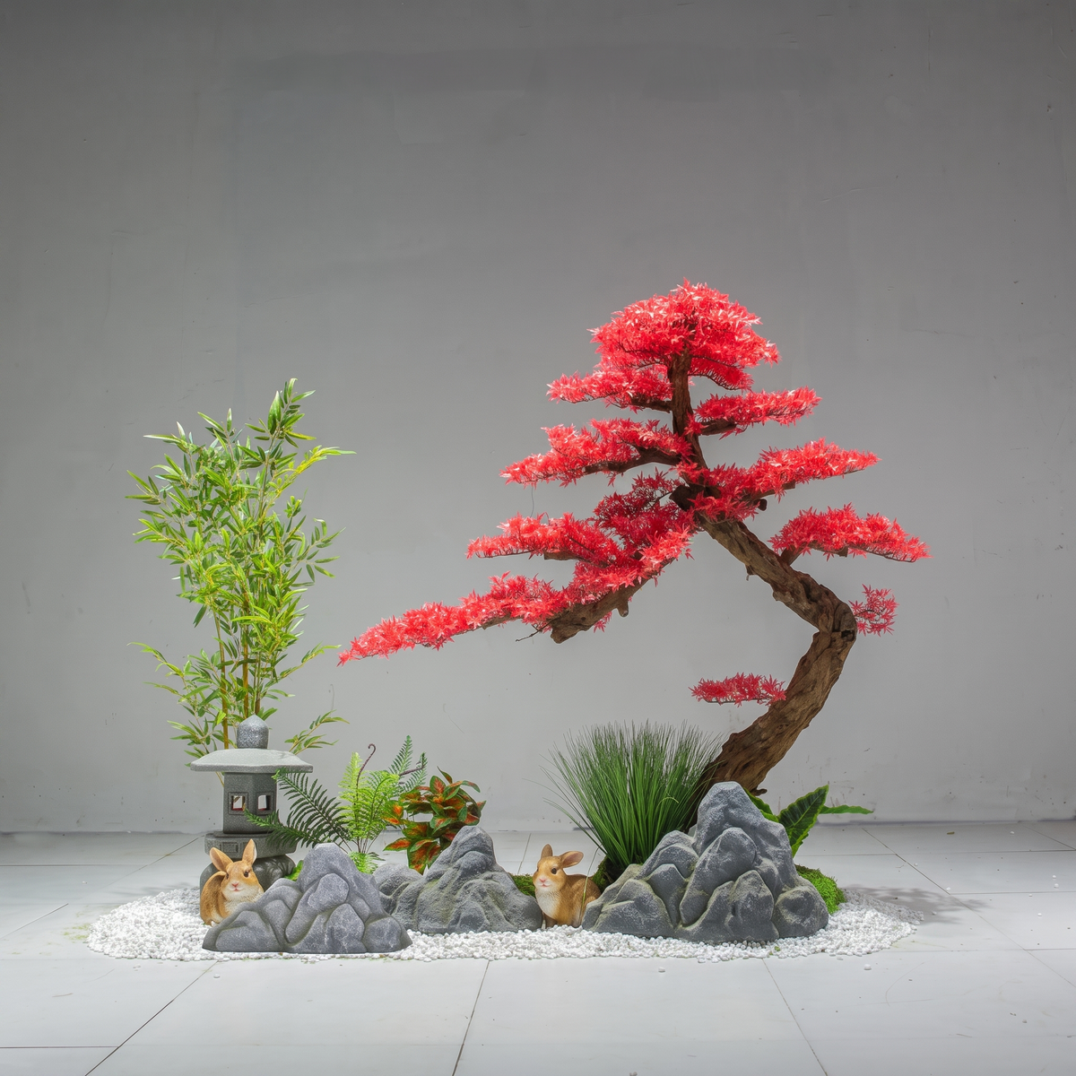 Artificial red maple tree with crimson foliage spreading across an open branch frame