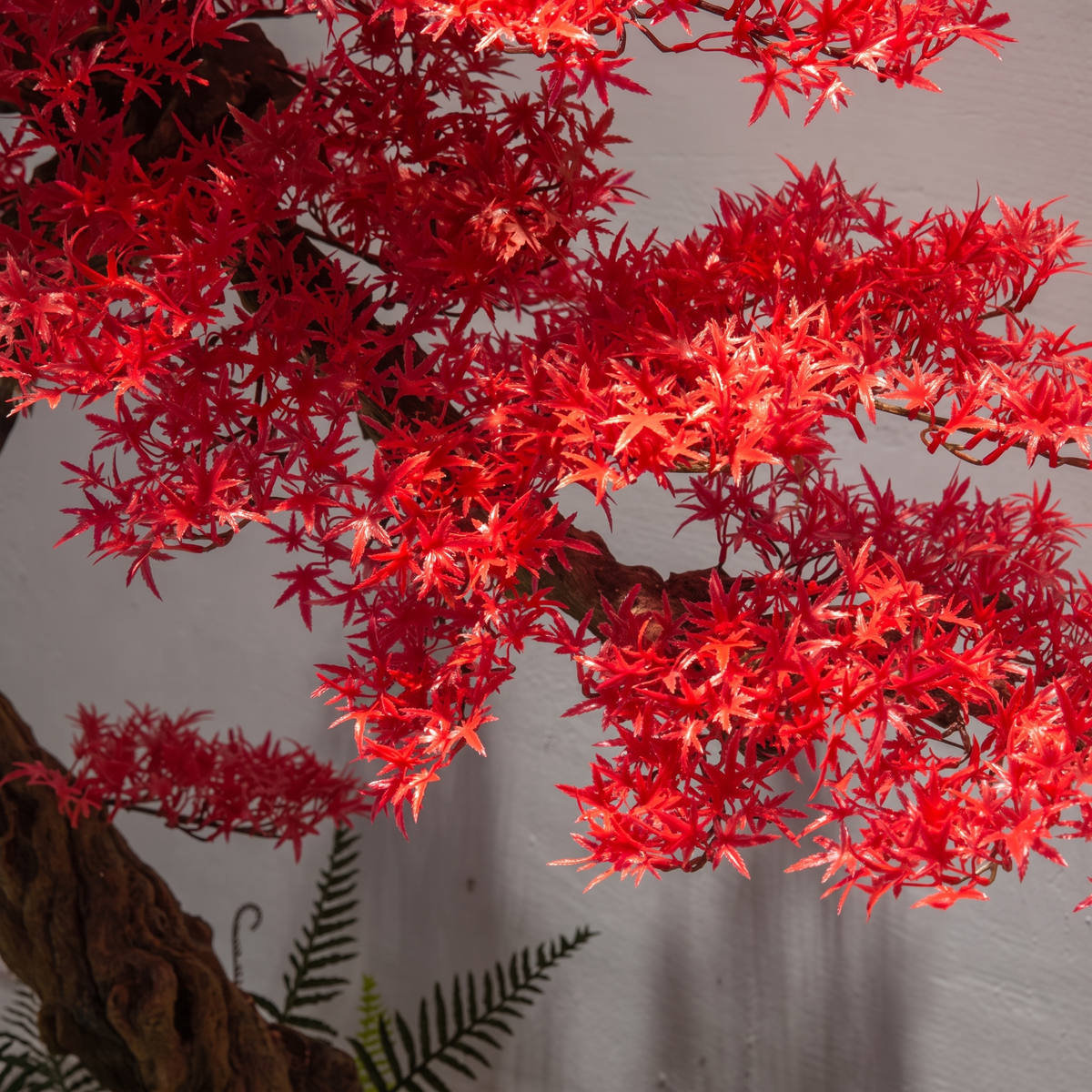 The red maple styled in a hotel stairwell as an indoor landscape feature
