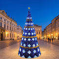Spruce style LED Christmas tree in a town square at dusk