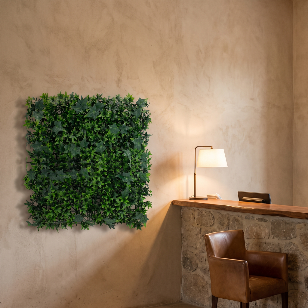Artificial grass wall tiles beside a hotel reception desk, shown at 1.6 x 1.6 ft