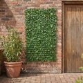 Extendable artificial trellis hedge panel on a garden wall