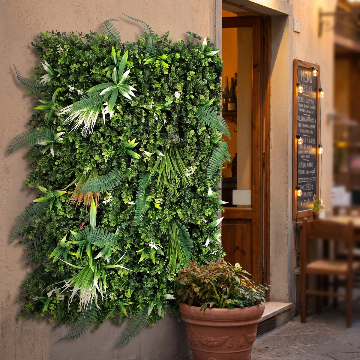 Vertical plant wall panels beside a restaurant entrance