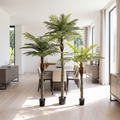 Tall faux date palm tree in a bright open-plan dining area