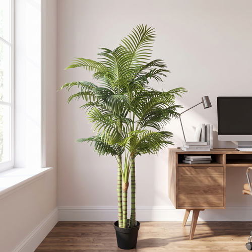 Artificial areca palm floor plant in a home office