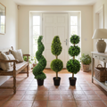 Artificial topiary ball tree on an entrance porch