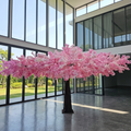 Large artificial cherry blossom tree in an event pavilion