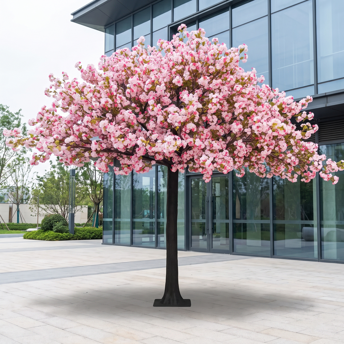 Artificial cherry blossom sakura tree on a landscaped plaza