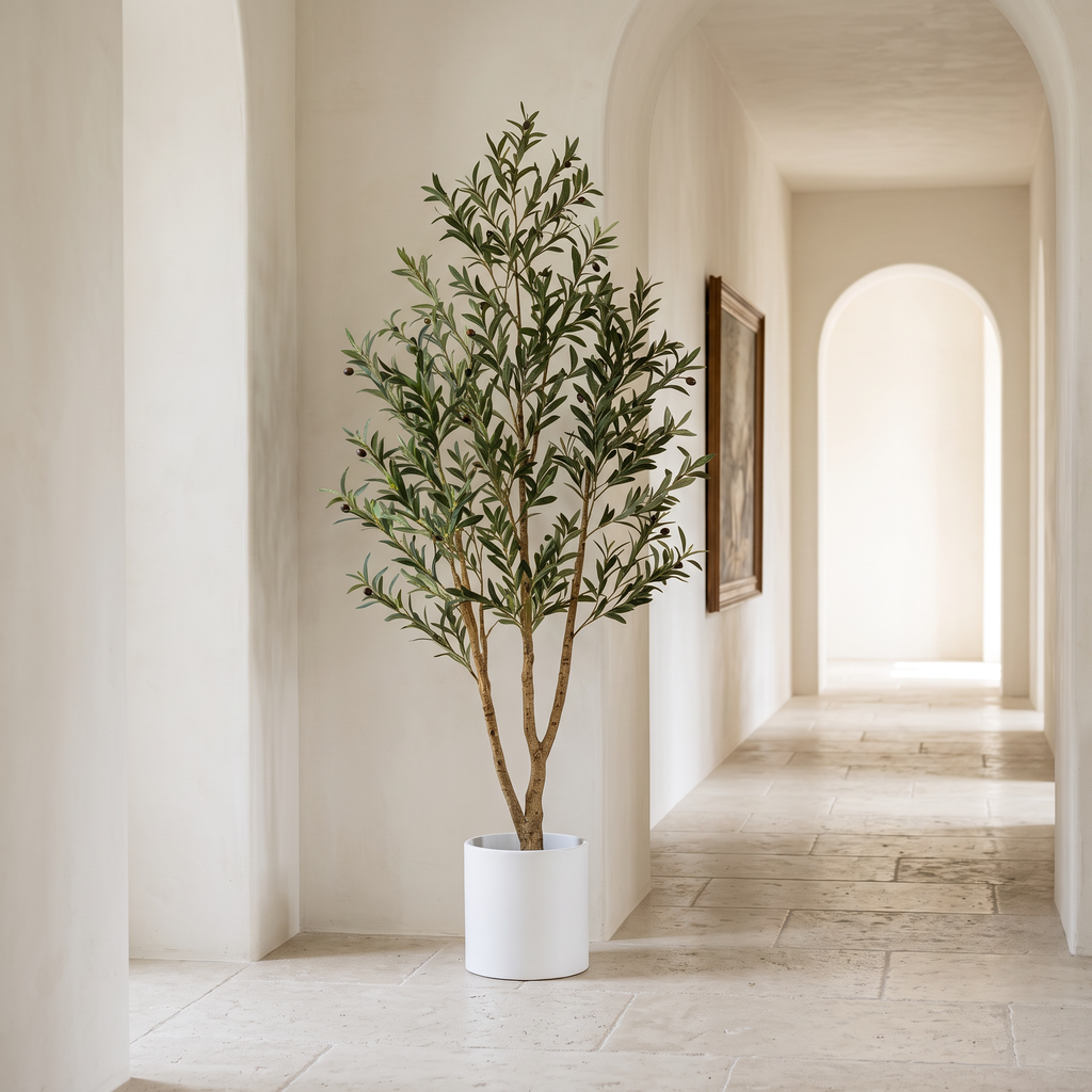 Artificial olive tree with a natural wood trunk in a tall planter
