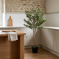 Artificial olive tree with a natural wood trunk and lifelike olive fruit