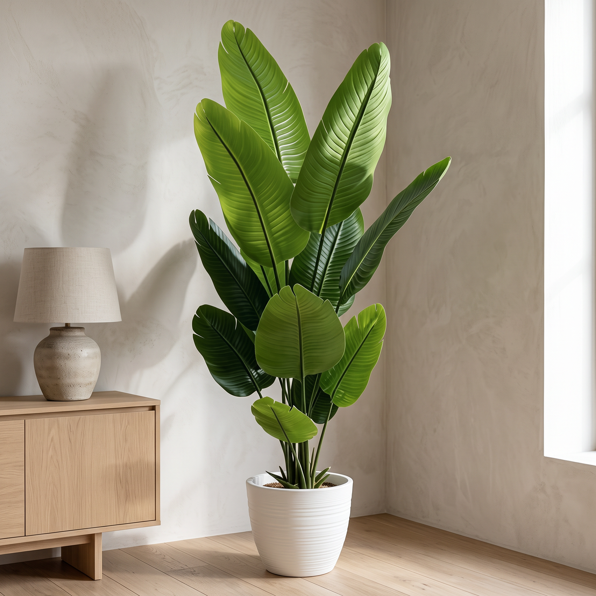 Artificial bird of paradise plant with silk leaves in a nursery pot
