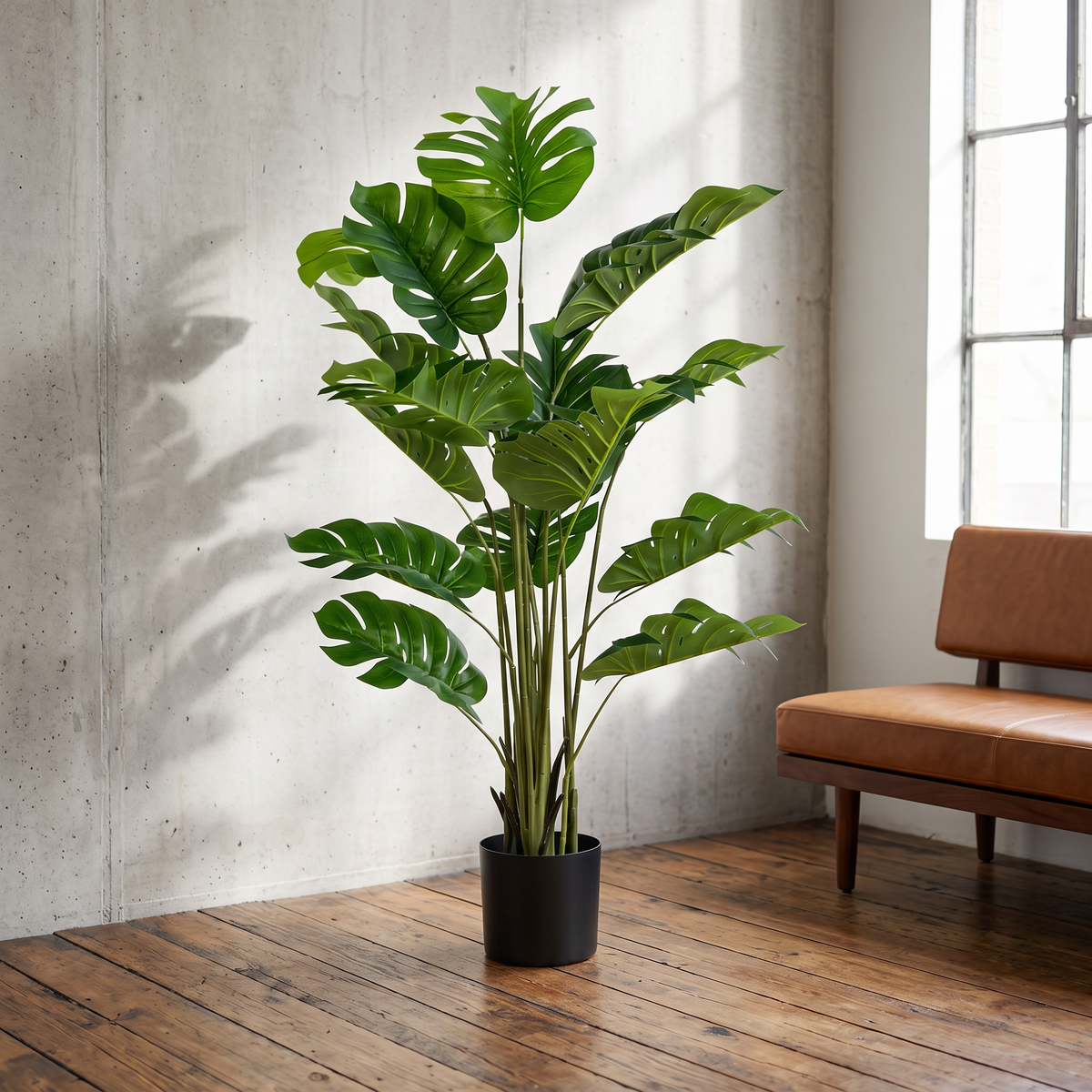 Artificial monstera deliciosa plant with 15 leaves in a cement-style pot