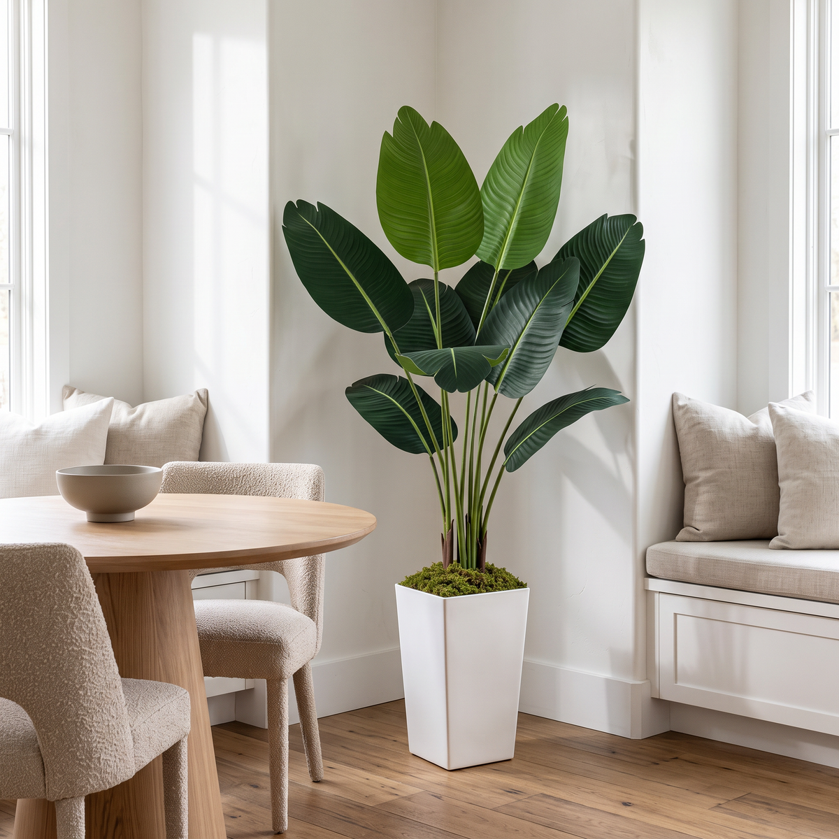 Artificial bird of paradise plant with silk foliage in a white planter