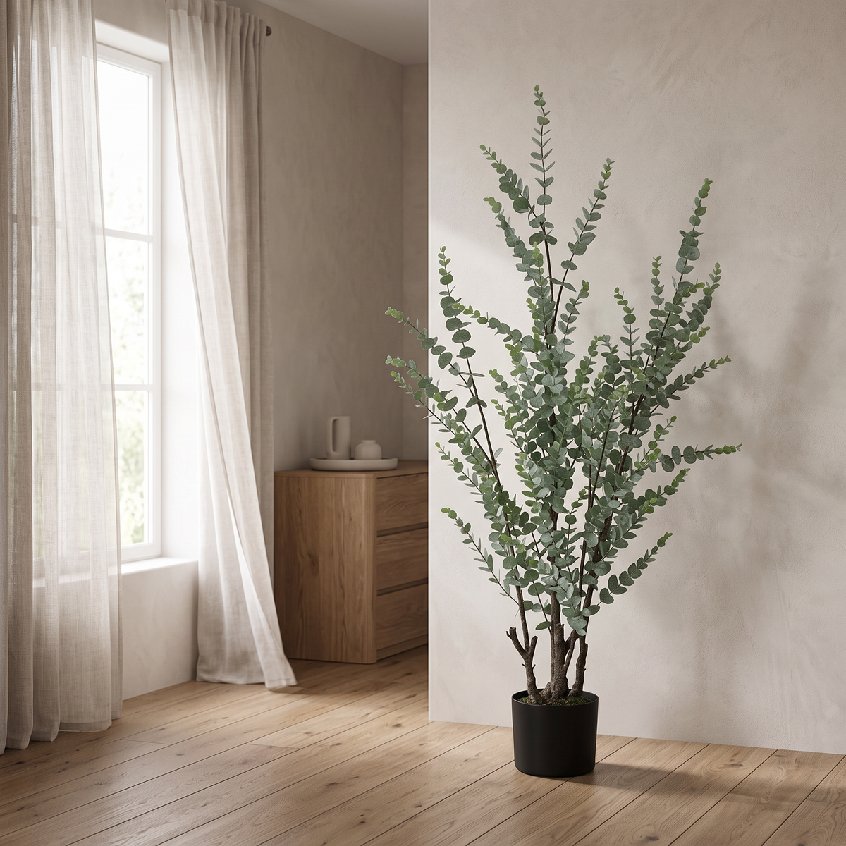 Artificial eucalyptus tree with dense frosted-green foliage in a black pot