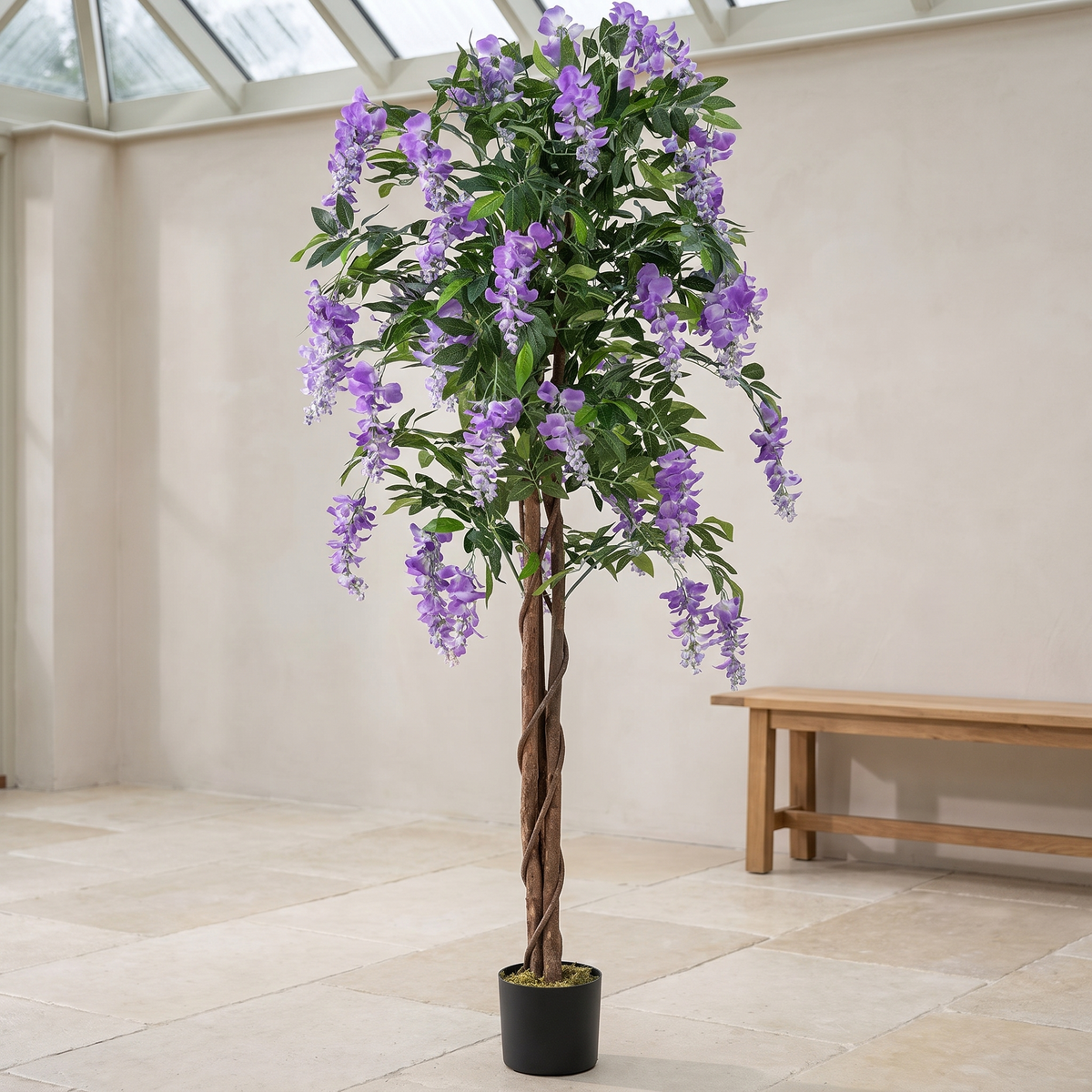Artificial wisteria tree with hanging blooms on a solid wood trunk