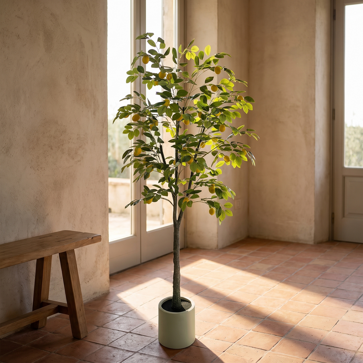 Artificial lemon tree with lemon fruit accents in a white pot