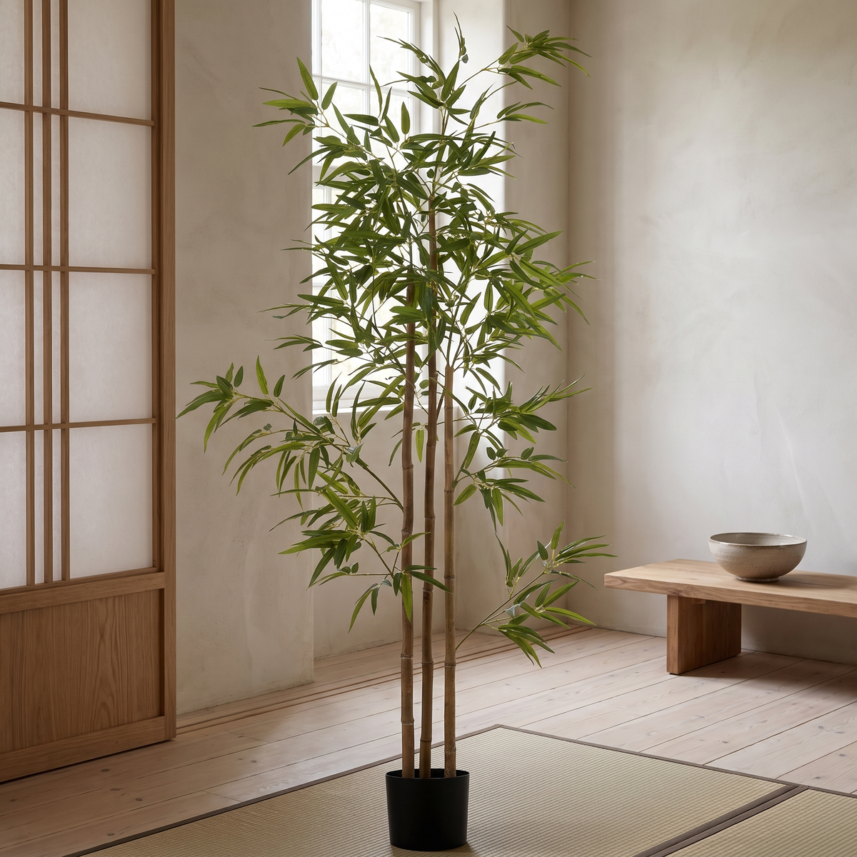 Artificial bamboo tree with three trunks and dense leaf clusters