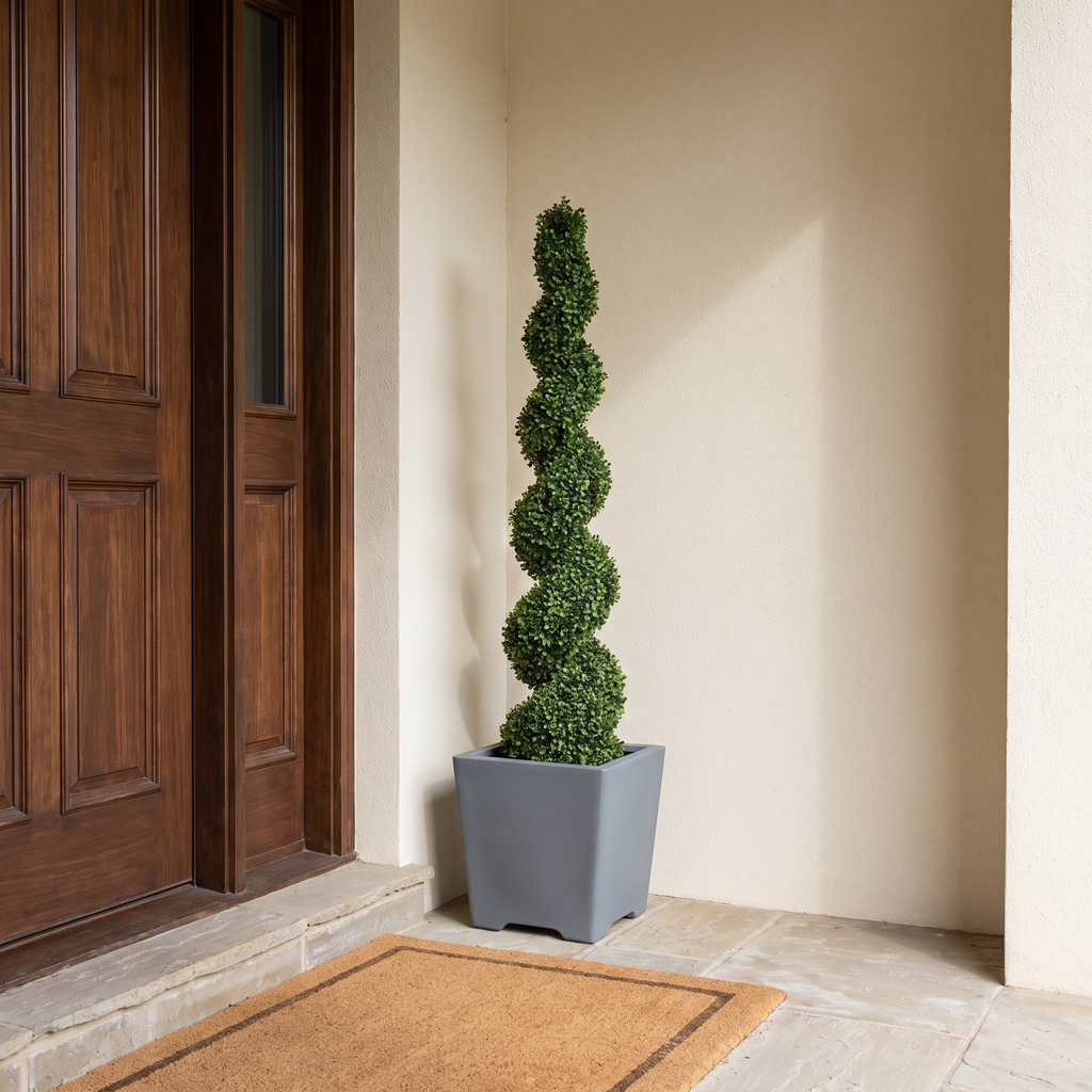 Artificial spiral-cut boxwood topiary tree, potted