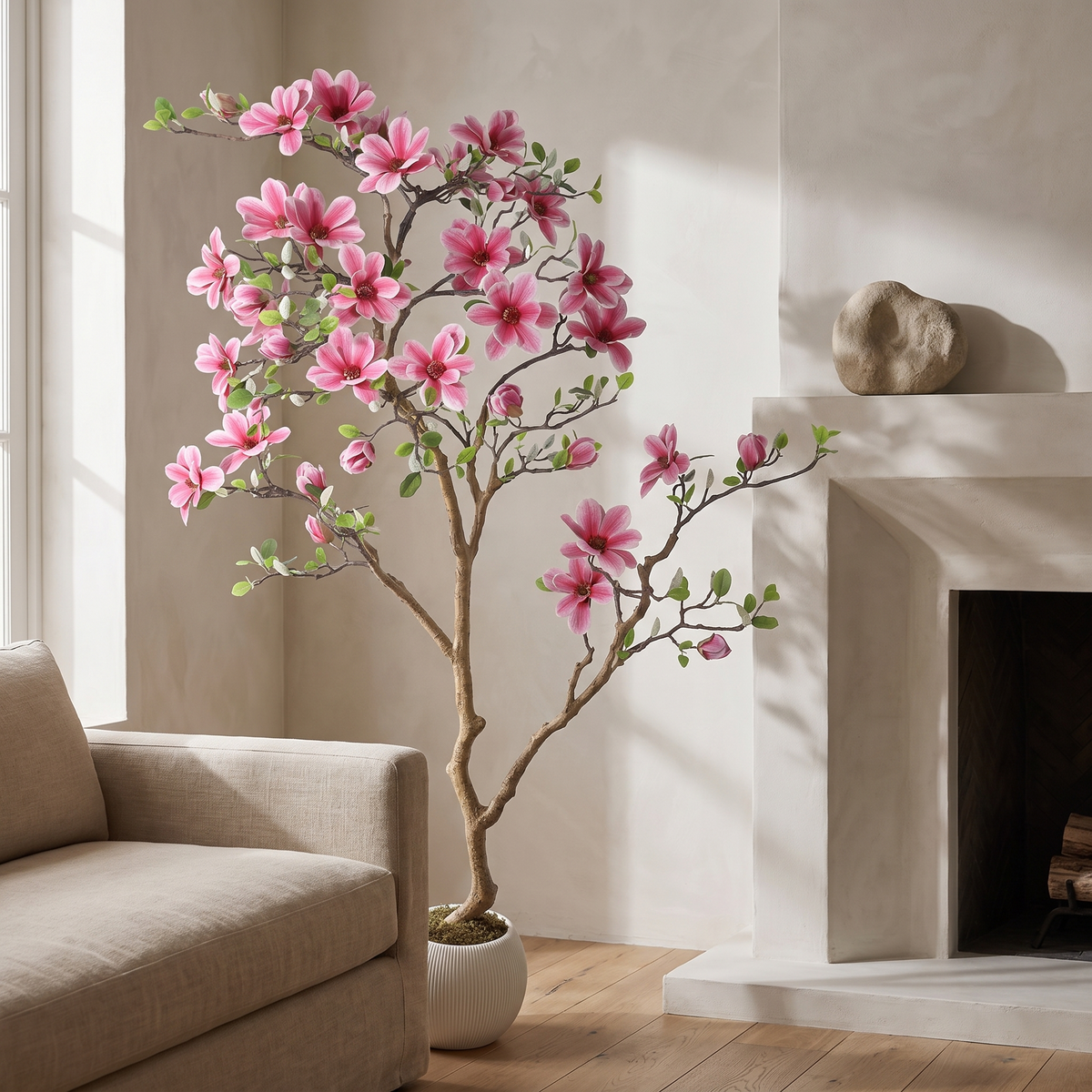 Artificial pink magnolia tree with UV-resistant blooms in a weighted pot