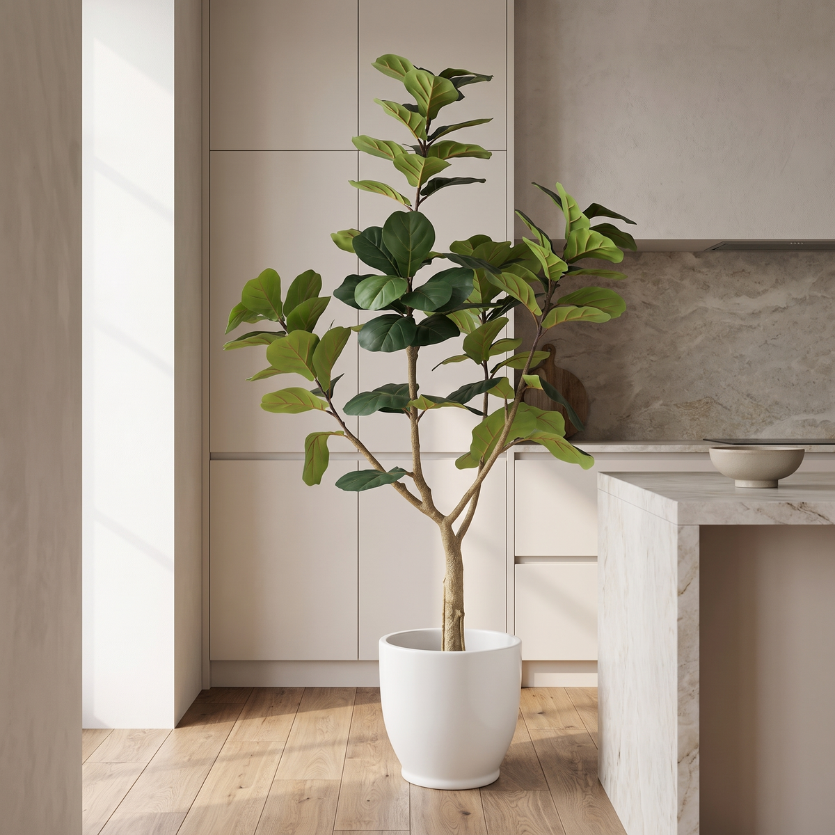 Artificial fiddle leaf fig tree in a black plastic pot