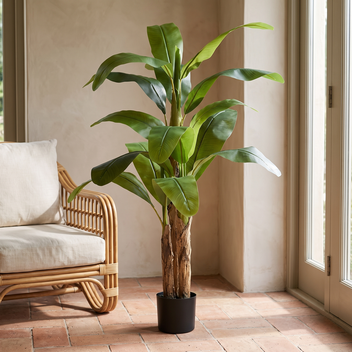 Artificial banana tree with a detachable trunk in a black pot