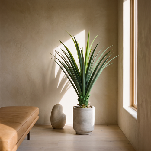 Artificial agave plant with spiked leaves in a black pot