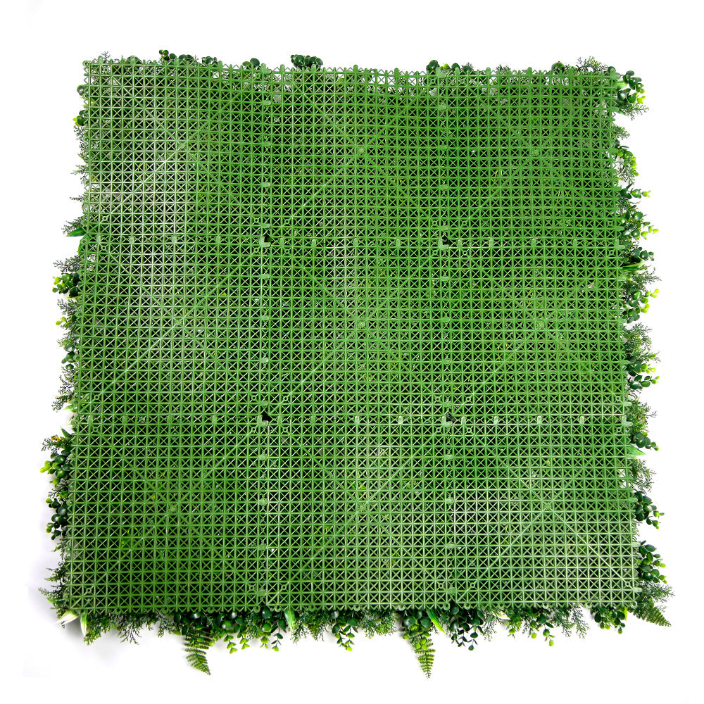 The panel used outdoors on a courtyard wall, greening a bare masonry surface