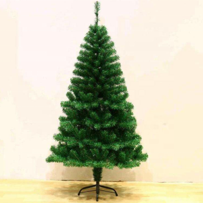 The tree dressed with baubles and ribbon for a festive indoor display
