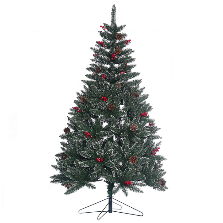 The full silhouette of the Christmas tree against a plain interior wall