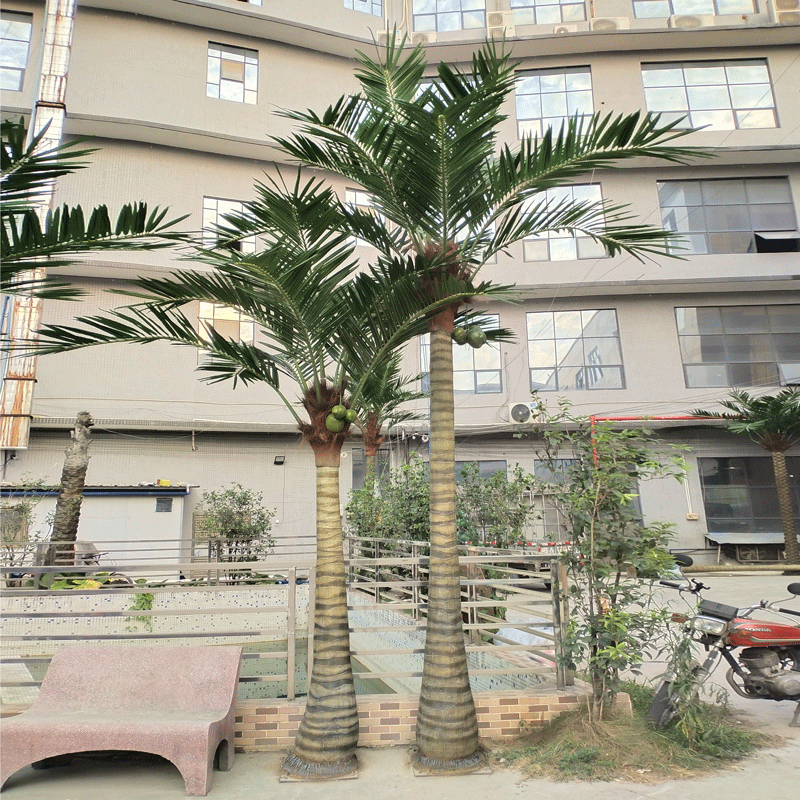 The metal trunk of the palm, wrapped and textured to look like palm bark