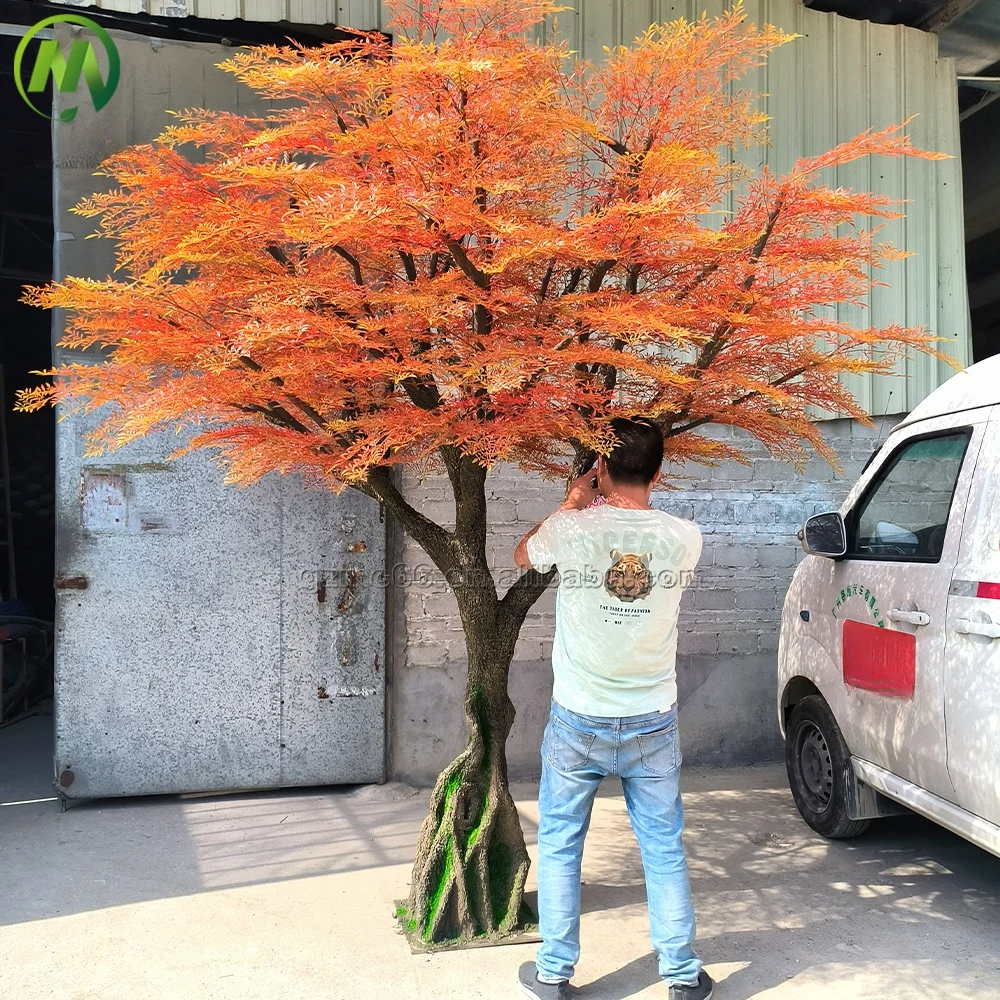 Artificial nandina tree with fine red-green foliage on a moulded fibreglass trunk