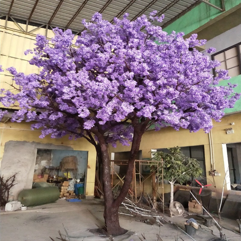 The 15ft jacaranda in a shopping mall, flowering canopy above the walkway