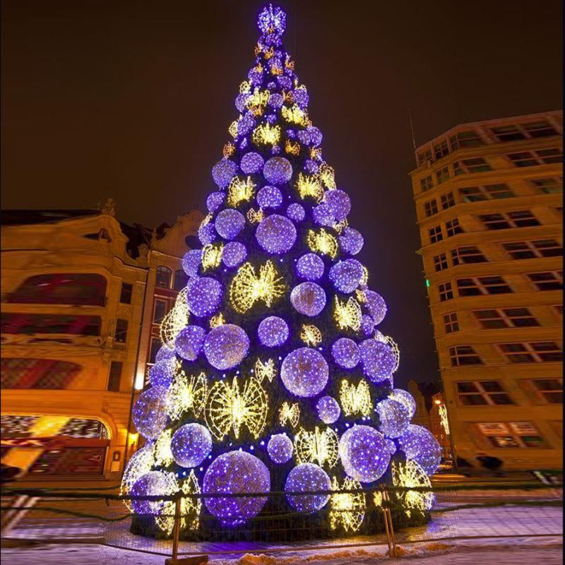 Large outdoor LED Christmas tree lit in RGB colour with its lighting synced to music