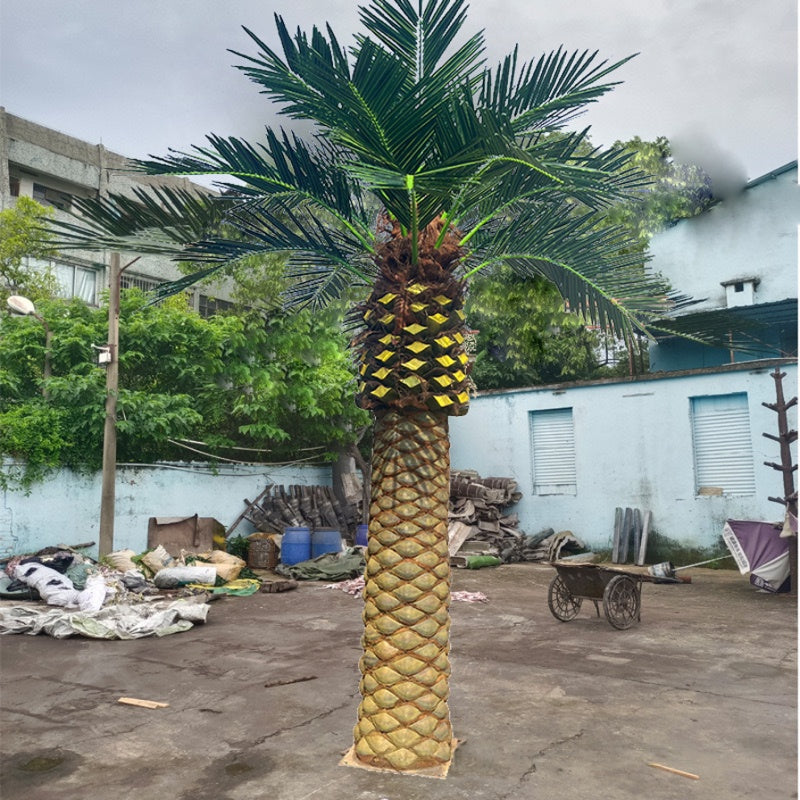 Artificial date palm 10ft (3m) tall, stiff fronds radiating from a fibrous trunk